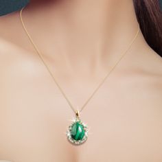 Malachite is a gorgeous green gemstone. Its light and dark green bands are very distinctive. It is said that Malachite can be worn to detect impending danger and it is believed to lend extra energy and bring harmony into one’s life. Crafted from sterling silver, plated in rich yellow gold suspends a teardrop of Malachite surrounded in shimmering white Diamondeau®, flawless simulated diamond. Luxury Malachite Elegant Necklace, Luxury Gold Malachite Necklace, Malachite Gemstone Round Pendant Necklace, Luxury Malachite Pendant Jewelry, Spiritual Malachite Pendant Necklace, Malachite Pendant, Green Gemstones, Dark Green, Time Piece