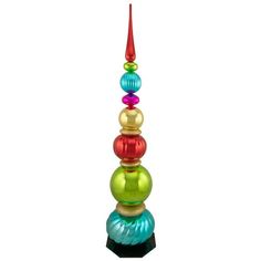 a multicolored glass sculpture on top of a black base