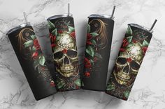 three tumblers with skulls and roses on them sitting next to each other, one has a straw in it