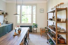 the kitchen is clean and ready to be used for cooking or baking, while also being used as a dining room