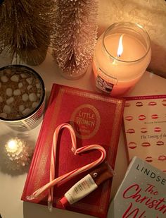 candles, books and candy canes on a table