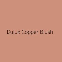 the words dulux copper blush on a pink background