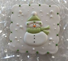 there is a snowman cookie on top of plastic