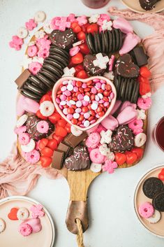 a table topped with lots of different types of desserts