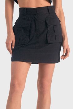 FINAL SALE: No returns or exchanges. This Cargo Mini Skirt from Elan will add an edge to your style. Strategically constructed flap front cargo pockets provide two spacious pockets to store your belongings, all in a timeless black color. Prepare for all occasions with this fashion-forward mini. 53% Lyocell | 47% Cotton Machine Wash Cold, Gentle Cycle; Hang Dry. This is a standard fit style and runs small, with Small =0-2, Medium =4-6, Large =8-10. Cargo Mini Skirt, Latest Skirts, Wrap Maxi Skirt, Cargo Skirt, Women Cargos, Layered Skirt, Fit Style, Black Skirt, White Skirts