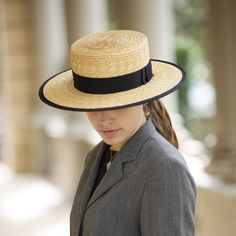 Introducing our Bolero Straw Hat, a timeless accessory handcrafted with care.  With its wide brim design, this boater straw hat is a versatile addition to any wardrobe, perfect for both women and men alike.  Crafted from high-quality natural straw, it offers a lightweight and breathable option for those sunny days. Whether you're strolling along the beach or enjoying a garden party, this elegant hat adds a touch of sophistication to any ensemble. Say hello to effortless style and sun protection Classic Wide Brim Top Hat For The Beach, Classic Top Hat For Beach Outings In Spring, Classic Spring Top Hat For Casual Beach Outings, Classic Straw Hat With Flat Crown For Beach, Formal Straw Boater Hat With Curved Brim, Wide Brim Toquilla Straw Panama Hat For Garden Party, Classic Flat Crown Straw Hat For Beach, Classic Fitted Boater Hat For Vacation, Formal Natural Straw Hat With Flat Brim