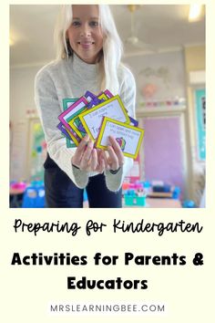 a girl holding up some cards with the words preparing for kindergarten activities for parents and teachers