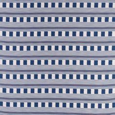 a blue and white striped fabric with small squares on the front, in an irregular pattern