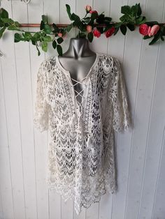 "Dreamy crocheted lace up front cover up dress, great for festivals, beach, holiday by New Look ivory colour In good pre-loved condition  Size M Approx UK10/12 US6/8 Manequin size UK8 for reference Measurements  Pit to pit 22\" Length 33\"  sleeve 8\" All orders are shipped using biodegradable and recycled packaging where possible" Crochet V-neck Beachwear Cover-up, Crochet V-neck Beach Cover-up, V-neck Crochet Beach Cover-up, Crochet V-neck Cover-up For Beachwear, Bohemian Hollow Out Dress For Beach Cover-up, Bohemian Summer Cover-up With Hollow Out Design, Bohemian Hollow Out Cover-up For Summer, Bohemian Hollow Out Crochet Dress For Beach Season, Spring V-neck Crochet Cover-up