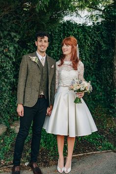 a bride and groom standing next to each other