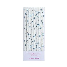 four white and blue paper straws with small birds on the top, in front of a