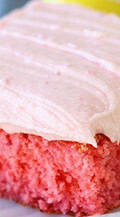 a close up of a piece of cake on a plate with frosted icing