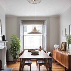 the dining room table is surrounded by wooden chairs