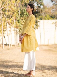 Yellow Printed Cotton Sunny Side Up Tunic Dress - Trendroots Long Sleeve Yellow Kurta For Summer, Casual Cotton Dresses For Eid, Yellow Long Sleeve Summer Kurta, Yellow Long Sleeve Kurta For Spring, Casual Yellow Kurta For Eid, Spring Yellow Cotton Kurta, Yellow Straight Kurta For Spring, Yellow Cotton Dress With Chikankari Embroidery, Traditional Yellow Tunic For Spring