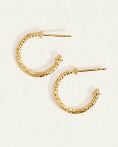 Small hoop earrings in textural 18k gold vermeil - perfect for stacking. Shop everyday hoops with character. Textured Small Hoop Yellow Gold Earrings, Textured Gold-plated Hoop Earrings, Textured Gold Plated Hoop Earrings, Textured Small Hoop Jewelry For Gifts, Textured Small Hoop Jewelry Gift, Textured Gold Plated Yellow Gold Jewelry, Textured Gold-plated Yellow Gold Jewelry, Dainty 14k Gold Hammered Hoop Earrings, Textured Yellow Gold-plated Jewelry