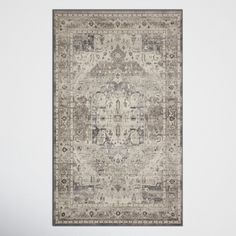 an area rug with grey and beige colors