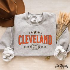 Show your team pride with our vintage Browns football sweatshirt. This unisex crewneck is ideal for game days and tailgating. Stay stylish and comfortable while cheering for the Cleveland Browns! Hey there! 😊👋 Looking for a cozy sweatshirt? You're in the right spot! I'm here to make your shopping experience awesome, so if you have any questions or just want to chat, feel free to reach out anytime. Here's why you'll love these sweatshirts:  ⭐ Cozy & Comfy: 50% cotton, 50% polyester blend (8.0 o Crew Neck T-shirt For Game Day In Fall, Game Day Team Name Sweatshirt In Athletic Heather, Game Day Fan Apparel Sweatshirt In Athletic Heather, Game Day Team Spirit Sweatshirt With Lettering, Team Spirit Sweatshirt With Lettering For Fan Gear, Athletic Heather Sweatshirt For Game Day, Vintage Letter Print Sweatshirt For Game Day, Crew T-shirt For Game Day In Fall, Game Day Crew T-shirt For Fall