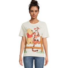 a woman wearing a winnie the pooh t - shirt