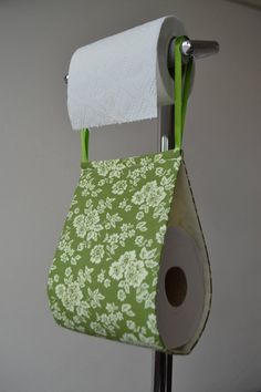 a roll of toilet paper hanging from a metal holder