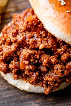 a sloppy joe sandwich on a wooden table