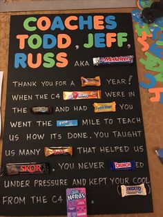 a sign that says coach todd jeff's, with candy bars on the side