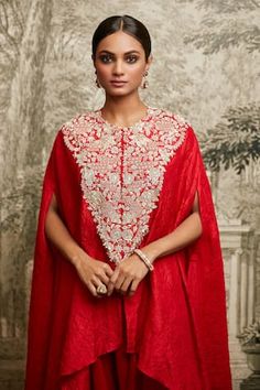 Red silk textured asymmetric kaftan featuring lampi embroidered floral vine motifs, embellished by pearl and sequins. Comes with asymmetric pant. - Aza Fashions Elegant Kurta With Zari Work And Cape Sleeves, Elegant Embroidered Kurta With Cape Sleeves, Festive Embroidered Kaftan With Cape Sleeves, Elegant Red Designer Wear Kaftan, Elegant Red Designer Kaftan, Festive Evening Kaftan With Dupatta, Elegant Festive Kurta With Cape Sleeves, Festive Elegant Kurta With Cape Sleeves, Red Embellished Silk Kurta