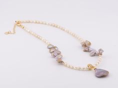 ♥ Golden Purple Mixed Pearl Necklace Choker with Removable Charm and Gold Plated Clasp P1031 ♥ The pearls measure 4 - 10mm and the charm is 22mm long without the bail. ♥ Necklace measures 16" with 2" extension. ♥ All stone(s) used are genuine, earth-mined, and guaranteed conflict free! As is with anything that is naturally occurring, our gemstones or pearls will have imperfections, e.g. inclusions in the gemstones, unevenness in the pearl nacre.♥ Free shipping in the US.♥ This is an in-stock ite Pearl Necklace Choker, Necklace Choker, Choker, Pearl Necklace, Choker Necklace, Gold Plate, Plating, Gemstones, Stone