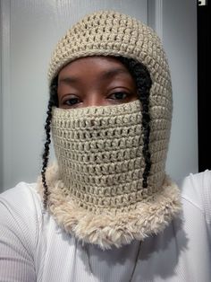 Inspired by trendy balaclavas that are a bit spicier than ski masks of old, this can be worn to protect your face from the cold or rolled up into a fly, fur brimmed hat.  Made of 100% quality acrylic yarn. Faux fur is polyester and super soft.  Made to order.  Pictured is taupe & gold frost.  Multiple colors available. Open to different color combinations. Message me with any inquiries. Ski Masks, Crochet Balaclava, Pan African Flag, African Flag, Brimmed Hat, Ski Mask, Black Crochet, Brim Hat, Acrylic Yarn