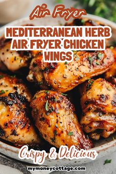 chicken wings in a bowl with herbs and seasoning on the side text reads, mediterranean herb air fryer chicken wings crispy & delicious