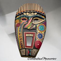 Immerse yourself in the rich cultural heritage of Colombia with this stunning handcrafted wooden mask, meticulously made from willow wood and enchapado in tamo. This unique piece of art captures the vibrant essence of Colombian craftsmanship, blending traditional techniques with contemporary design. Design and Quality Our mask features intricate patterns and vibrant colors, showcasing the meticulous craftsmanship of Colombian artisans. Each detail is carefully carved and inlaid with tamo, a trad Colombian Culture, Colombian Art, Wooden Mask, Willow Wood, Eco Friendly Home, Large Decor, Masks Art, Eco Friendly House, Art Unique