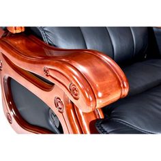 a black leather reclining chair with wood trimmings and an arm rest on it