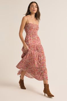 Say hello to your new favorite floral. The Balos Lima Midi Dress from Z Supply has comfortable, classic smocking on the bodice with a tiered skirt design. Adjustable spaghetti straps give everyone a better, custom fit. Pair it with cowgirl boots; moto boots and a leather jacket; a pair of tennis sneakers; or, obviously, sandals! You can't go wrong with this style. Content: Shell 55% cotton, 45% Rayon Lining, 100% Rayon Care: Hand Wash Cold w/ Like Colors, Line Dry Floral Skirt Outfits, Tennis Sneakers, Over The Knee Socks, Cactus Flower, Knee Socks, Tier Skirt, Skirt Design, Tiered Skirt, Casual Style Outfits