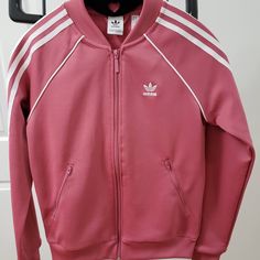 Adidas Essentials 3-Stripes Track Jacket Color: Pink Size: Xs New, Never Worn. Comes From A Pet-Free And Smoke-Free Home. Thanks For Checking Us Out! Spring Streetwear Track Jacket With Contrast Stripes, Sports Outerwear With Side Stripes, Fall Track Jacket With Side Stripes, Fall Track Jacket With Side Stripes And Long Sleeves, Spring Streetwear Track Jacket With Side Stripes, Casual Track Jacket With Side Stripes For Spring, Sporty Long Sleeve Outerwear With Side Stripes, Spring Casual Track Jacket With Side Stripes, Casual Spring Track Jacket With Side Stripes