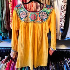 Flowy, Vibrant Tunic. Bright Happy Colors. No Size Tag But Fits Like A L/Xl. Never Worn. Smoke And Pet Free Home. Make An Offer. Bohemian Yellow Tops With Floral Embroidery, Yellow Bohemian Tops With Floral Embroidery, Yellow Embroidered Beach Top, Yellow Embroidered Top For Beach, Yellow Floral Embroidery Tops For Vacation, Yellow Long Sleeve Tops With Floral Embroidery, Yellow Embroidered Tops For Fall, Embroidered Yellow Tops For Vacation, Yellow Embroidered Top For Vacation