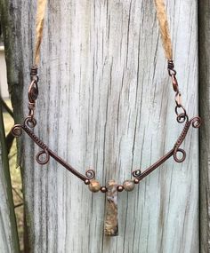 Stunning Woven Copper Necklace with Picasso Jasper and Copper Beads on a Silk Ribbon Cord. The Silk cord and handmade clasp measure 15 1/2" and the woven copper component is approximately 4" long 5" wide. This piece has been antiqued, polished and sealed. Sealed with Protectaclear. ProtectaClear is a clear, protective coating that is tough enough to protect jewelry and is safe for wear against skin. ProtectaClear is practically invisible once applied and will seal and protect jewelry from tarnis Bohemian Brown Electroformed Necklaces, Bohemian Brown Necklace With Copper Wire, Bohemian Brown Copper Wire Necklace, Brown Hand Wrapped Nature-inspired Jewelry, Nature-inspired Hand Wrapped Brown Jewelry, Nature-inspired Brown Hand Wrapped Jewelry, Adjustable Hand Wrapped Nature-inspired Necklaces, Adjustable Copper Necklace With Natural Stones, Adjustable Wire Wrapped Nature-inspired Necklace