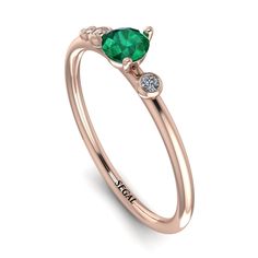 Pretty minimalist thin ring in perfect proportions and style can be used as a gift for your loved one. Minimalist style with immensely beautiful Emerald enhances the beauty of this ring. This ring would express love to your loved one. Stock Number: 1822 Metal Setting Metal Type: 14K Rose Gold Main Stone Type: 100% Natural Green Emerald Size: 0.25Ct / 4mm Shape: Round Cut Color: Green Clarity: SI (Eye Clean) Additional Stones Stone Type: Natural Conflict-free Diamonds Number / Total Weight: 2 Sto Statement Engagement Ring, Vintage Engagement Rings Sapphire, Ruby Bands, Edwardian Ring, Express Love, Black Diamond Engagement, Vintage Sapphire, Vintage Style Rings, Black Diamond Ring Engagement