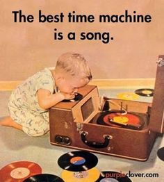 a little boy playing with an old record player