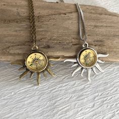 Please note: If you need more than one, multiple quantities are available upon checkout. A real working compass is set into a beautiful sun ray bezel to create a unique necklace. A beautiful gift for an avid hiker or traveler. The sun pendant is about 35mm long and 42mm wide. It is available in antique silver tone and antique gold tone. The pendants are plated brass. The compass is brass with a glass face. It measures 16mm in diameter. The compass is delicate and should be handled with care. Due Outdoor Medallion Necklace With Compass Design, Outdoor Compass Design Round Pendant Jewelry, Outdoor Compass Design Round Jewelry, Compass Jewelry, Sun Charm, Sun Necklace, Round Locket, Oval Locket, Hiking Gifts