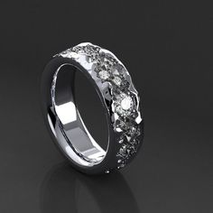 a white gold ring with three diamonds on the inside and outside, set in 18k white gold