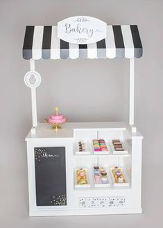 a white and black striped ice cream stand