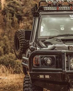 an off - road vehicle is parked in the mud