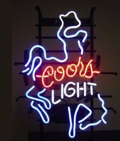 a neon sign that says goods light up