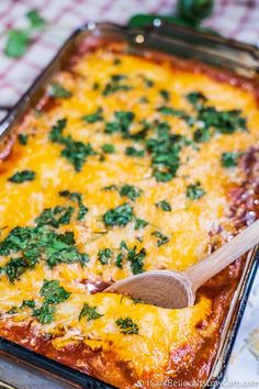 a casserole dish with cheese and herbs