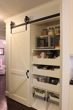 an open barn door in a kitchen