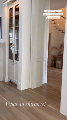 an empty living room with white walls and wood flooring is pictured in this image