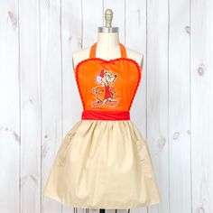 a dress on a mannequin with an image of mickey mouse