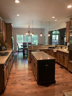 a large kitchen with an island in the middle