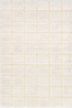 a white rug with squares on it