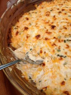 a casserole dish with chicken and cheese in it, ready to be eaten