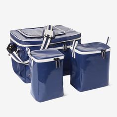 three blue cooler bags sitting next to each other